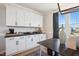 Well-appointed butler's pantry with white cabinetry and quartz countertops at 871 Parc Townes Dr # 1, Wendell, NC 27591