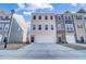 Two-story townhome with attached garage and neutral siding at 871 Parc Townes Dr # 1, Wendell, NC 27591