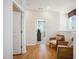 Light-filled hallway with two comfy chairs and access to bedrooms at 871 Parc Townes Dr # 1, Wendell, NC 27591
