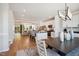 Open concept kitchen with island, stainless steel appliances, and white cabinets at 871 Parc Townes Dr # 1, Wendell, NC 27591