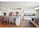 Modern kitchen boasts an island, stainless steel appliances, and white cabinetry at 871 Parc Townes Dr # 1, Wendell, NC 27591