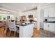 Open concept kitchen with white cabinets and breakfast bar at 871 Parc Townes Dr # 1, Wendell, NC 27591