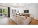 Spacious living room with hardwood floors and access to balcony at 871 Parc Townes Dr # 1, Wendell, NC 27591