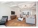 Light and airy living room with hardwood floors and coffered ceiling at 871 Parc Townes Dr # 1, Wendell, NC 27591