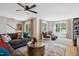 Open living space with sectional sofa, sunlit bay window and golf course views at 871 Parc Townes Dr # 1, Wendell, NC 27591
