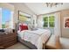 Spacious main bedroom with wood-paneled walls and a comfortable bed at 871 Parc Townes Dr # 1, Wendell, NC 27591