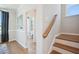 Wooden staircase with a view of a powder room at 871 Parc Townes Dr # 1, Wendell, NC 27591