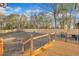 Large backyard with wooden deck, privacy fence, and playset at 1004 N Fayetteville Ave, Dunn, NC 28334