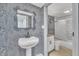 Second bathroom with pedestal sink and tub at 1004 N Fayetteville Ave, Dunn, NC 28334