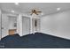 Spacious bedroom with neutral walls, blue carpet, and large closet at 1004 N Fayetteville Ave, Dunn, NC 28334