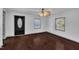 Bright living room featuring hardwood floors, and neutral paint palette and modern ceiling fan with lighting at 1004 N Fayetteville Ave, Dunn, NC 28334