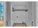 This walk-in closet includes ample storage space and convenient access to the outdoors at 1004 N Fayetteville Ave, Dunn, NC 28334