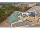 Aerial view of community featuring tennis courts, pool, clubhouse, landscaping, and parking at 1008 Ashton Oak Ct, Durham, NC 27703