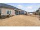 A spacious fenced backyard features a covered patio, providing ample space for outdoor enjoyment at 1008 Ashton Oak Ct, Durham, NC 27703