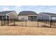 Wide view of the backyard with black fencing and neighboring properties, showcasing community living at 1008 Ashton Oak Ct, Durham, NC 27703