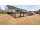 Spacious backyard features a well-maintained lawn and secure fencing, perfect for outdoor activities at 1008 Ashton Oak Ct, Durham, NC 27703