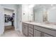 Bathroom featuring double vanity and a walk-in closet at 1008 Ashton Oak Ct, Durham, NC 27703