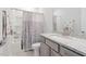 Bathroom with granite vanity, shower with dragonfly curtain and brushed nickel fixtures at 1008 Ashton Oak Ct, Durham, NC 27703