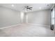 Large bedroom with neutral walls, carpet, bright light, and a ceiling fan at 1008 Ashton Oak Ct, Durham, NC 27703