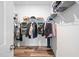 Walk-in closet with shelves, hanging rods, and hardwood floors at 1008 Ashton Oak Ct, Durham, NC 27703