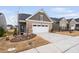 Well-maintained single-Gathering home with a two-car garage and a beautifully landscaped yard at 1008 Ashton Oak Ct, Durham, NC 27703