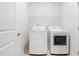Laundry room with washer, dryer, and shelving for extra storage at 1008 Ashton Oak Ct, Durham, NC 27703