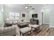 Cozy living room with comfortable seating, ceiling fan, and stylish decor at 1008 Ashton Oak Ct, Durham, NC 27703