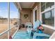 Inviting screened porch with comfortable seating and views of the fenced yard at 1008 Ashton Oak Ct, Durham, NC 27703