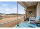 Relaxing screened porch features comfortable seating and a view of the backyard at 1008 Ashton Oak Ct, Durham, NC 27703