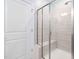 Bright shower with glass door and tiled walls at 1008 Ashton Oak Ct, Durham, NC 27703