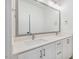 Double vanity bathroom with modern fixtures and large mirror at 126 Sanderway Dr, Chapel Hill, NC 27516