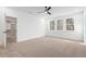Bright bedroom with carpeted floor and walk-in closet at 126 Sanderway Dr, Chapel Hill, NC 27516