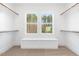 Spacious walk-in closet with built-in shelving and natural light at 126 Sanderway Dr, Chapel Hill, NC 27516