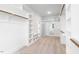 Large walk-in closet with built-in shelves and rods at 126 Sanderway Dr, Chapel Hill, NC 27516