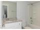 Clean bathroom with a tub, toilet and granite vanity at 1741 Old Fields Blvd, Haw River, NC 27258