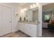 Double vanity bathroom with granite countertops and a view of the bedroom at 1741 Old Fields Blvd, Haw River, NC 27258