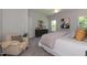 Bright bedroom with a king-size bed, comfortable seating, and lots of natural light at 1741 Old Fields Blvd, Haw River, NC 27258
