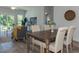 Bright dining area with wood table and chairs near the living room at 1741 Old Fields Blvd, Haw River, NC 27258