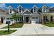 Townhouse with gray siding and two-car garage at 1741 Old Fields Blvd, Haw River, NC 27258