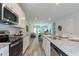 Open concept kitchen with stainless steel appliances and granite countertops at 1741 Old Fields Blvd, Haw River, NC 27258