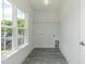 Bright laundry room with window and overhead lighting at 1741 Old Fields Blvd, Haw River, NC 27258