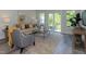 Cozy living room with a sofa, armchair, and access to backyard patio at 1741 Old Fields Blvd, Haw River, NC 27258
