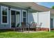 Enjoy outdoor dining on this private patio, featuring a seating area and a privacy fence at 1741 Old Fields Blvd, Haw River, NC 27258