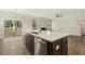 Kitchen island with white countertop, stainless steel dishwasher, and sink at 181 Sage Ln, Four Oaks, NC 27524