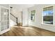 Bright and spacious living room with hardwood floors and large windows at 181 Sage Ln, Four Oaks, NC 27524