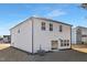 Spacious backyard with sliding door leading to the home, complemented by white vinyl siding at 216 Horseshoe Pl # 25, Angier, NC 27501