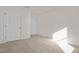 A clean and simple bedroom with two doors and neutral carpeting at 216 Horseshoe Pl # 25, Angier, NC 27501