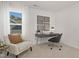 Bright home office featuring a modern desk, stylish chair, and natural light from the window at 216 Horseshoe Pl # 25, Angier, NC 27501