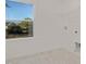Well-lit laundry room features tile floors, window with view, and utility connections at 216 Horseshoe Pl # 25, Angier, NC 27501