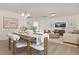 Inviting living room and dining area featuring modern decor, comfortable seating, and ample natural light at 216 Horseshoe Pl # 25, Angier, NC 27501